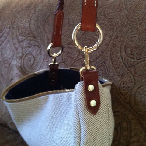 Clutch with horse brow band handle